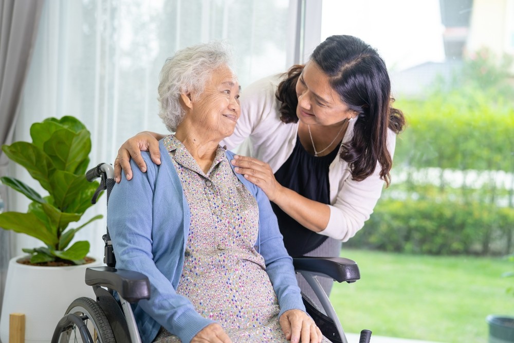Senior woman smiling at her caregiver
